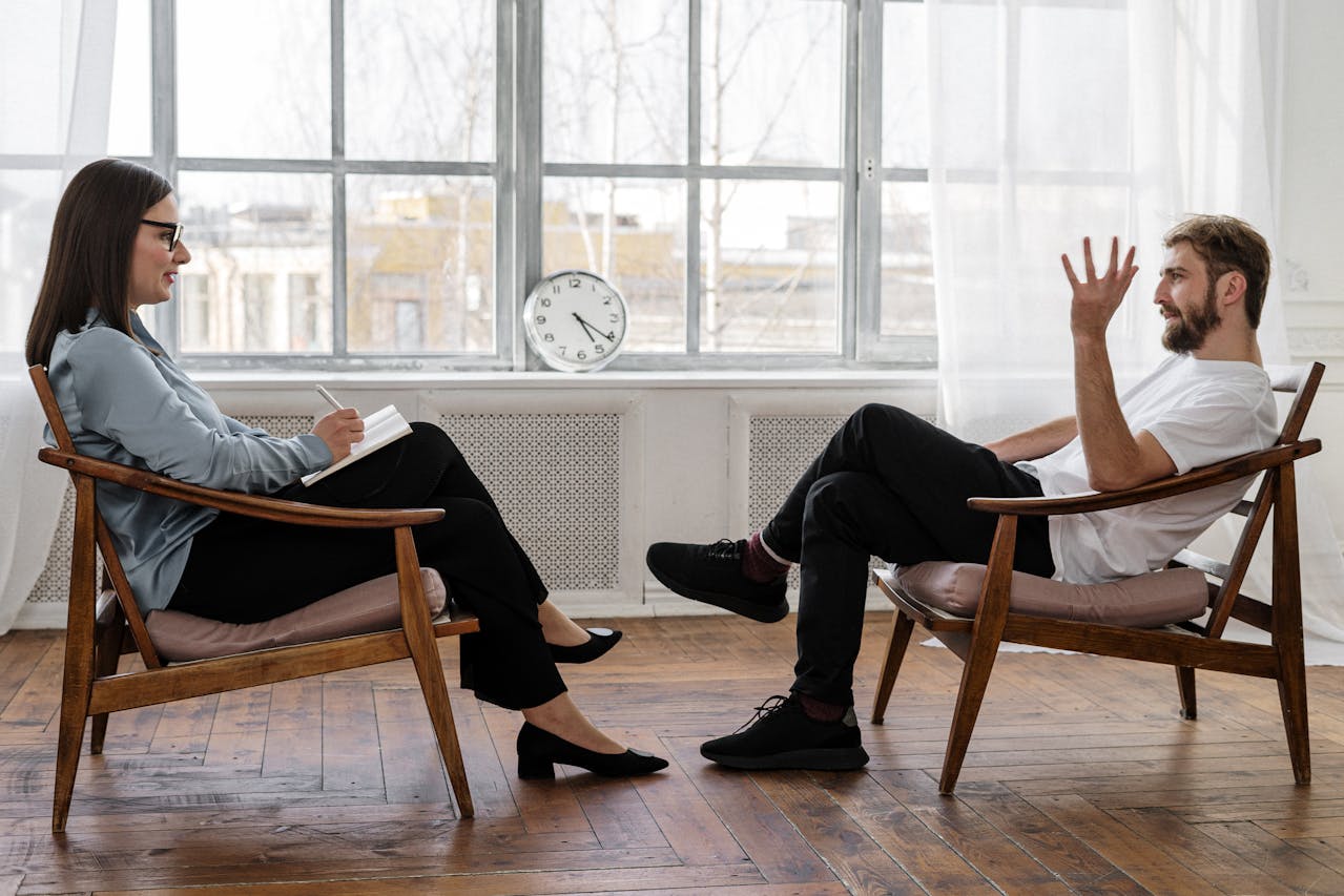 a man and woman sitting in chairs