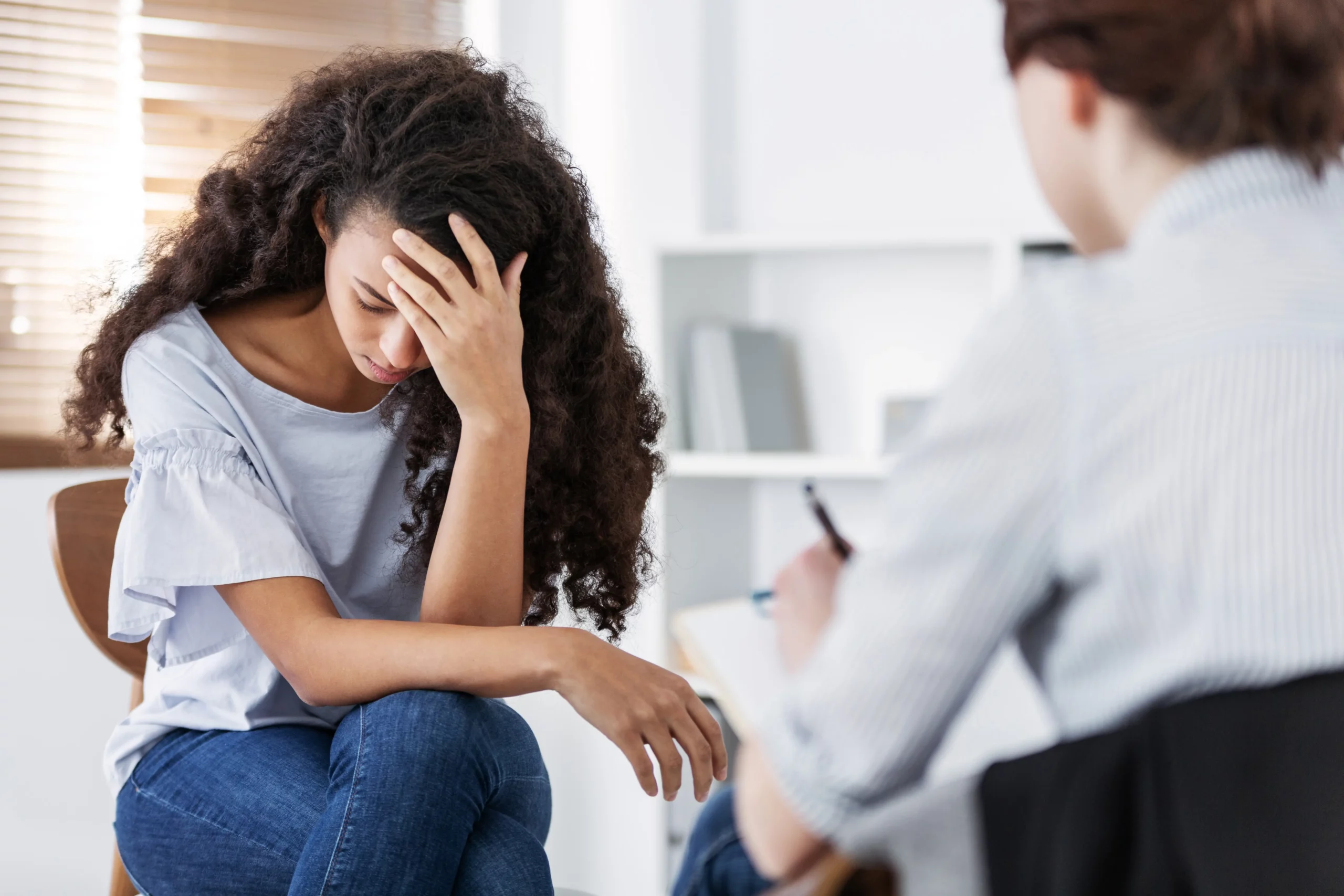 professional-psychotherapies-and-young-woman-suffe-2021-08-27-14-49-09-utc-scaled